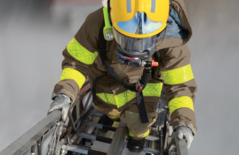ArmorAP_Khaki_firefighter-ascends-ladder-web